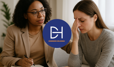 A professional therapist offering support to a stressed client during a counseling session.
