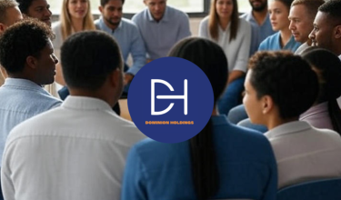 A group of workers, including both men and women, sitting in a circle with space between them, viewed from the back of the class during a wellness team building discussion.